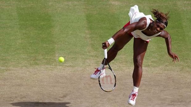 Serena Williams serves against Petra Kvitova on Day Ten.