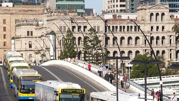 Buses line up across the Victoria Bridge during peak hour in Brisbane.