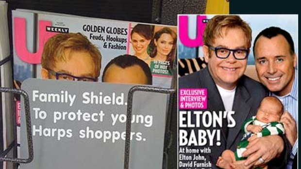 Cover up ... how the store masked the magazine cover of Elton John with partner David Furness and their baby, Zachary.