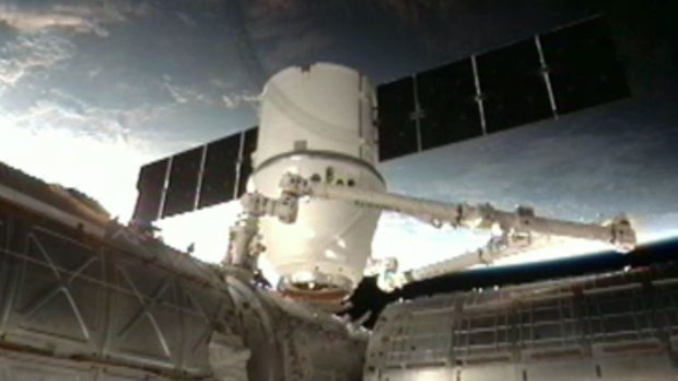 The SpaceX Dragon anchoring to the International Space Station.