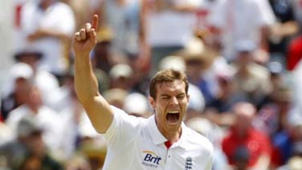 England's Chris Tremlett roars his joy at picking up the wicket of opener Phillip Hughes yesterday.