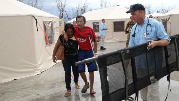 Help is here: Displaced victims of Typhoon Haiyan are being treated for injuries at a field hospital set up by Australians.
