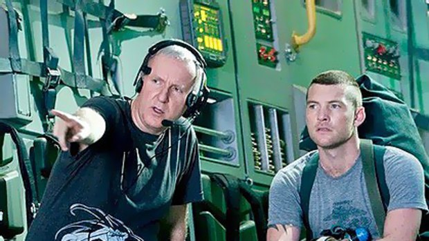 Sam Worthington (right) with James Cameron on the Avatar set.
