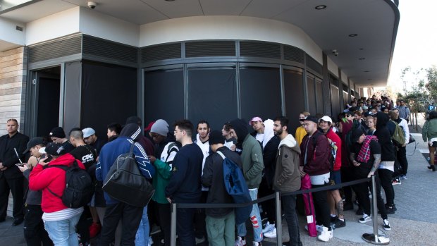Kanye West fans line up for the opening of his pop up clothing store in Bondi, Sydney. The queues started forming at 6 pm the night before the 10 am opening, with many people paying others to sleep in line for them.