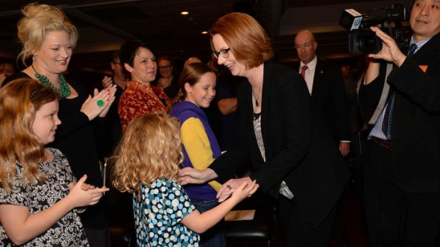 The Prime Minister greets young girls at the ALP State Conference at Moonee Valley on Saturday.