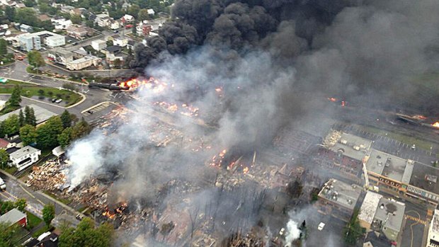 In this image released by Quebec provincial security, fires burn in Lac-Mégantic hours after the train derailment.