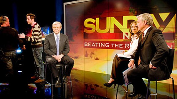 Mr Rudd on the set of last night's program with presenters Chris Bath and Mike Munro.