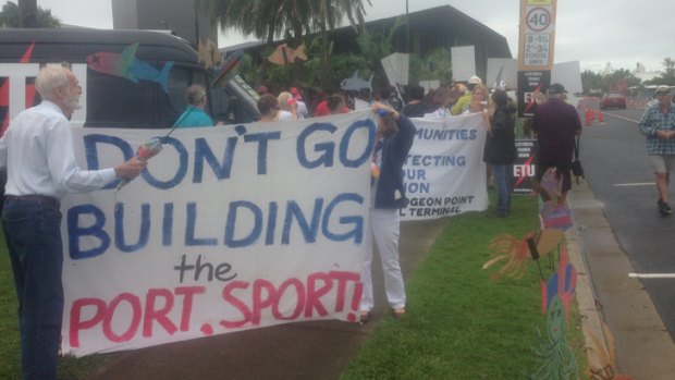 Protestors outside the Mackay Convention Centre, where the Queensland Plan summit is being held.
