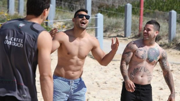 The morning after: The Rabbitohs Ben Te’o and Adam Reynolds were all smiles at Maroubra Beach during a recovery session on Saturday morning.