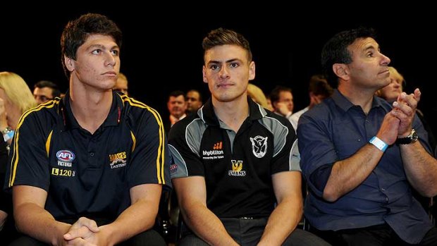 Swan Districts youngster Stephen Coniglio (centre) officially became a Greater Western Sydney Giant tonight.