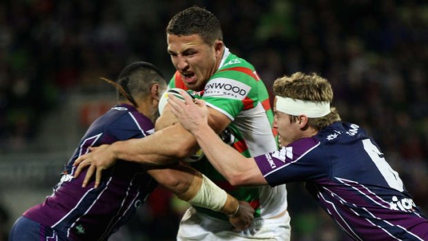 'It's finals footy now': The Rabbitohs' Sam Burgess is tackled during South Sydney's 26-8 loss to the Storm last month.