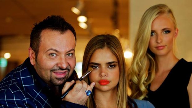 Brush with fame ... Napoleon Perdis puts the finishing touches on model Samantha Harris’s make-up. Perdis says  his products are  for the woman on the street as well as the runway.