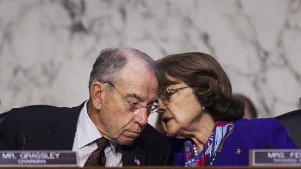 Senator Chuck Grassley, a Republican from Iowa and chairman of the Senate Judiciary Committee, left, speaks with ranking member Senator Dianne Feinstein, a Democrat from California.