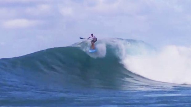 Dave Muir riding a wave.