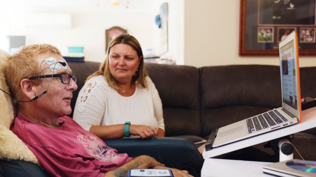 ALS sufferer Glenn Sargood, fitted with Peter Ford's NeuroSwitch device, at home with his wife Rachel.