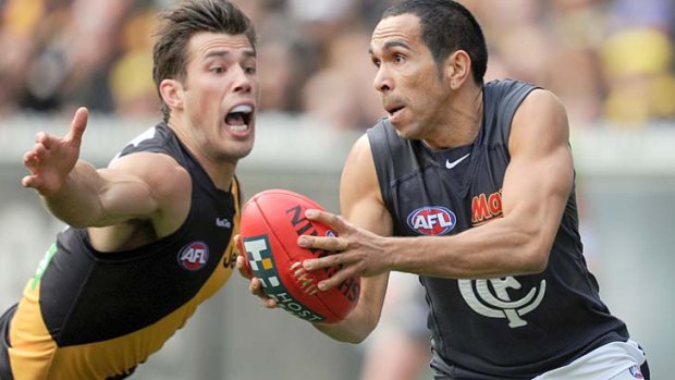 Desperate times: Tiger Alex Rance tries to smother the ball as Carlton's Eddie Betts looks to get a handpass away at the MCG.