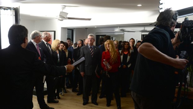 Frank, standing behind the man in the striped tie, gave it a red-hot go at Alisa and Lysandra's level one auction.