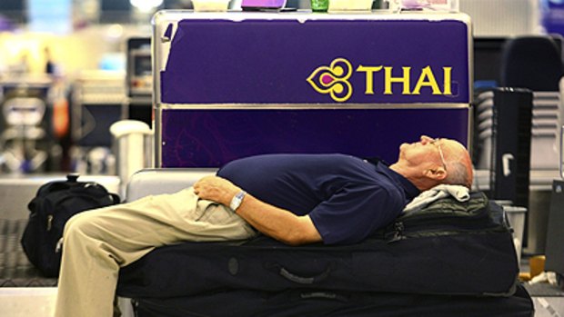 A European tourist sleeps at Suvarnabhumi airport, Bangkok in the early hours of Wednesday Nov. 26, 2008.