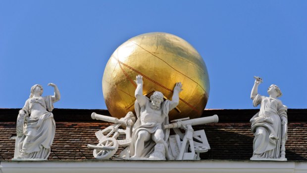 Atlas carries a golden globe on his shoulders on the roof of the Austrian National Library in Vienna.