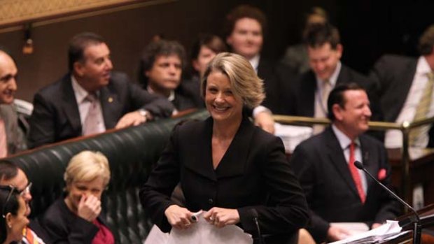NSW Premier Kristina Keneally entertains colleagues in Parliament yesterday.