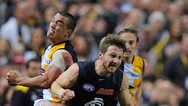 Carlton's Zach Tuohy crashes into Eagles midfielder Daniel Kerr during the semi-final on Saturday.