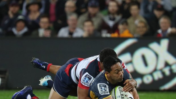 Over he goes: Christian Lealiifano touches down for the Brumbies.