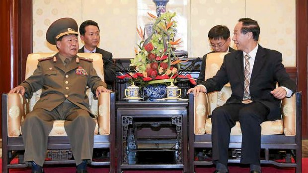 "Open to dialogue": North Korea's Choe Ryong-hae (right), the military's top political officer, meets in Beijing with Wang Jiarui, head of China's International Department of the Communist Party.