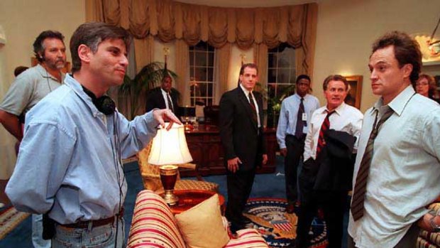 Aaron Sorkin (front left) on the set of West Wing with Martin Sheen (second from right) and Bradley Whitford (far right).