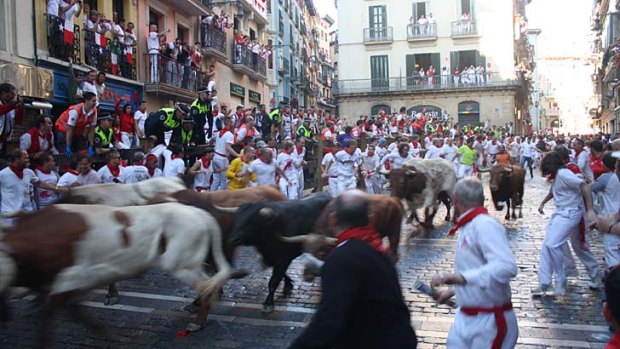 Hundreds take to the streets: The Running of the Bulls is the most important tradition for San Fermin, and it is also the most dangerous.