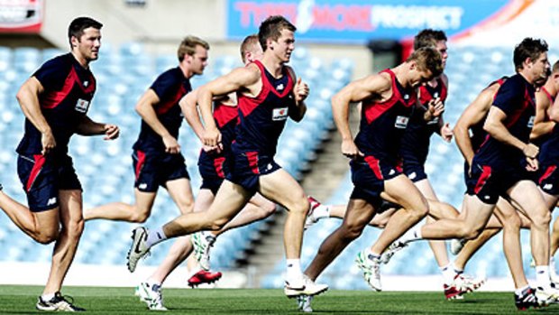 Melbourne players train in Adelaide ahead of their NAB Cup match tonight.