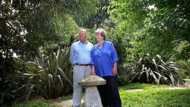Ranald and Patricia Macdonald in front of a staddle stone they imported from Wiltshire.