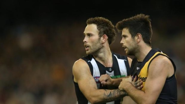 Brent Macaffer tussles with Trent Cotchin.