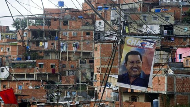 Cult of personality &#8230; a poster of Venezuala's seriously ill leader in a Caracas slum.
