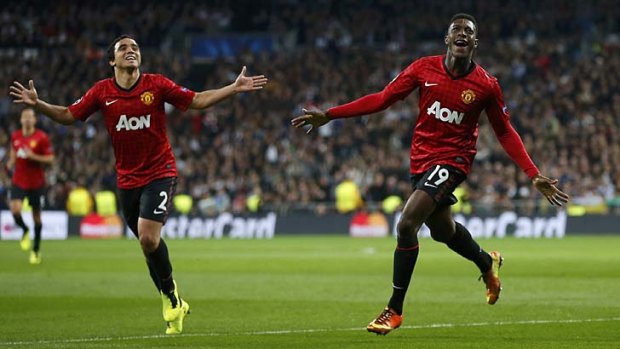 Bernabeu crucible ... United's Danny Welbeck, right, celebrates his goal with Rafael Da Silva. Manchester drew 1-1 with Real Madrid.
