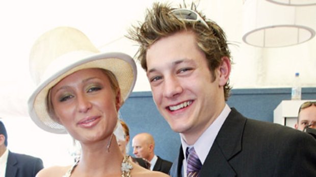 Paris Hilton and former Australian Idol contestant Rob "Millsy" Mills in the Birdcage on Melbourne Cup day in 2003.