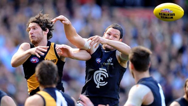 Up and at 'em: Richmond's Ty Vickery and Carlton's Robert Warnock contest the ball.