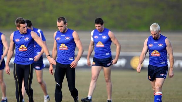 Before the fall ... Jason Akermanis, far right, at training yesterday just before his sacking by the Bulldogs.