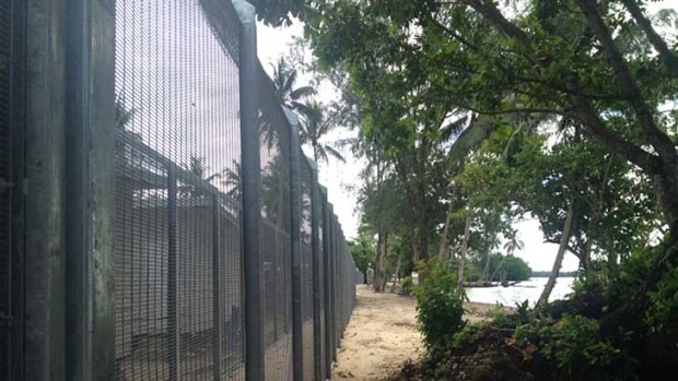 Three-metre high security fences are installed around the Manus Island detention centre.