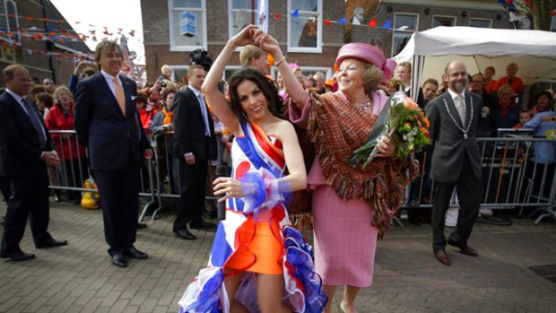 Birthday bash ... Queen Beatrix tries her hand at salsa.