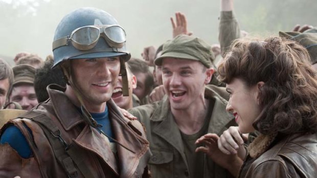 Unlikely hero ... Steve Rogers (Chris Evans) is greeted by Peggy Carter (Hayley Atwell) in <i>Captain America</i>.
