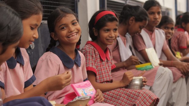 Students laugh at the Prerna Girls School, a place where girls are taught their rights as women in the world.