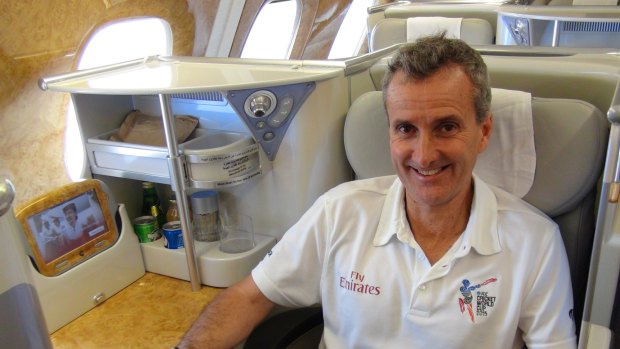 That's the business: Cricket umpire Billy Bowden enjoys another Emirates flight with all the bells and whistles.