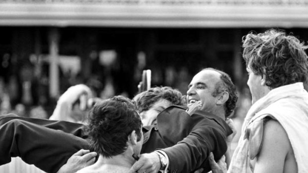 Immortal ... Clive Churchill is chaired off the field by his players during the victory lap after Souths won the 1971 Rugby League Grand Final.