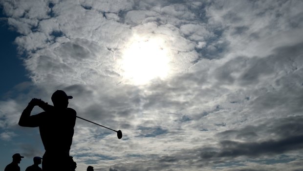Still in the spotlight: Tiger Woods practises at St Andrews.