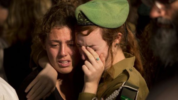 Mourners at the funeral for Israeli soldier Sergeant Barkay Shor' in Jerusalem.