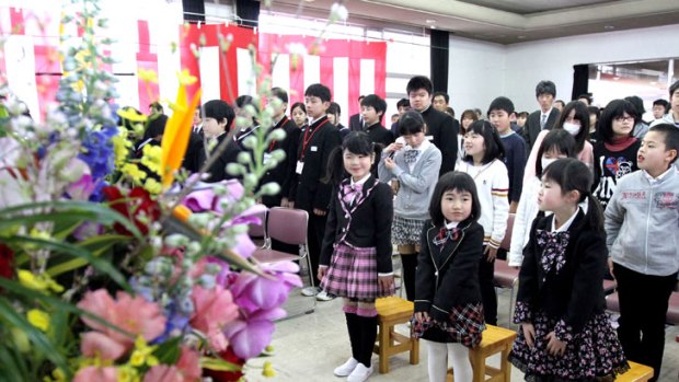 Pupils have been welcomed back to their school in the village of Kawauchi, near the Fukushima nuclear plant.