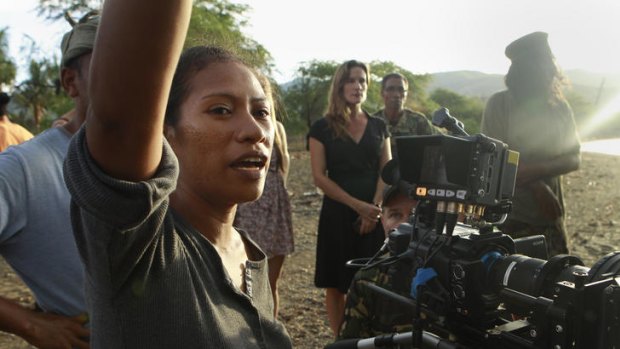 Dili woman Bety Reis directs the cast, with Kirsty Gusmao in the background.