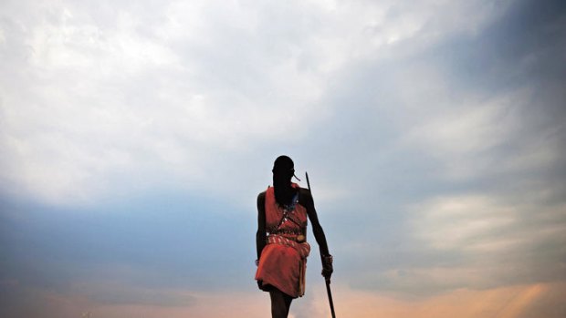Wild at heart … a Masai warrior surveys his starkly beautiful homeland.