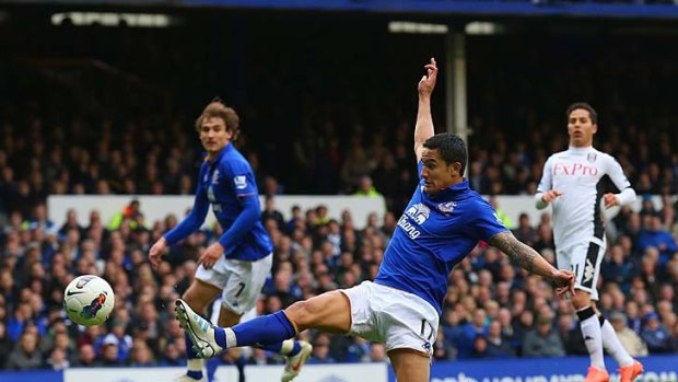 Awesome foursome: Tim Cahill scores Everton's fourth goal in the win over Fulham.
