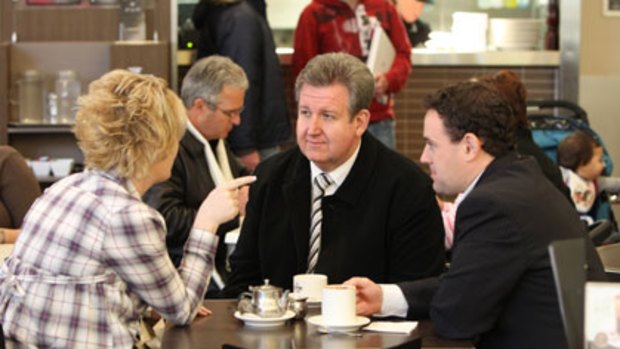 Battleground ... Barry O'Farrell and Liberal candidate Stuart Ayres campaign at Penrith Mall yesterday.